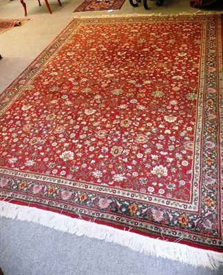 Lot 1116 - Lahore Carpet Punjab The burgundy field of millefleur design enclosed by indigo borders of...