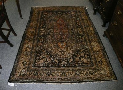 Lot 1120 - Ghom Silk Rug  Central Persia The lozenge shaped field enclosing a burnt orange central...