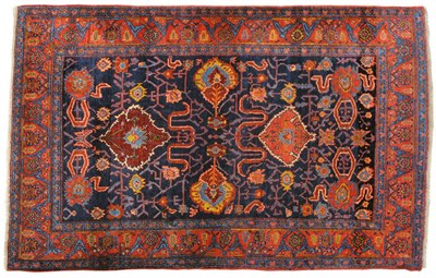 Lot 1124 - Bidjar Rug Persian Kurdistan The indigo field of large flowerheads and cloud bands enclosed by...