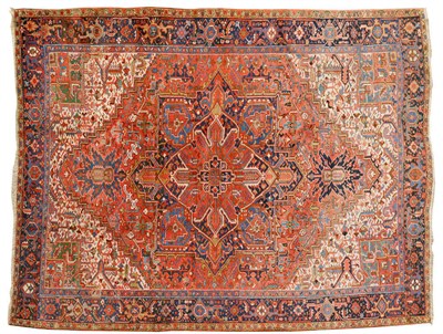 Lot 1127 - Heriz Carpet Persian Azerbaijan The stepped salmon pink field of angular vines around a typical...