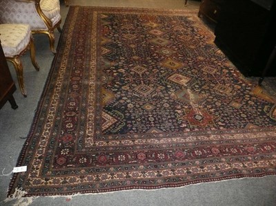 Lot 1128 - Tabriz Carpet Persian Azerbaijan The mid indigo field with columns of hooked medallions...