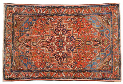 Lot 1132 - Bakhtiari Carpet West Persia The abrashed madder field of flowering trees and plants around a...