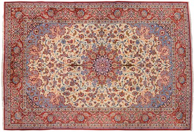 Lot 1136 - Isfahan Carpet Central Persia The ivory field of palmettes and flowering vines around an indigo and