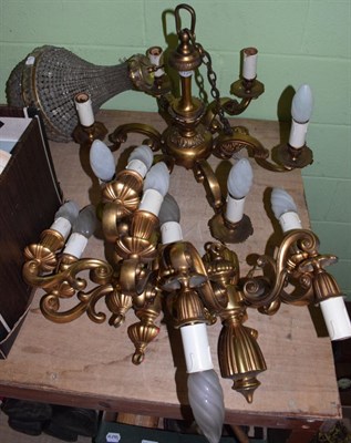 Lot 1129 - A gilt brass six-light chandelier with four matching twin-light wall sconces; and a glass bead drop