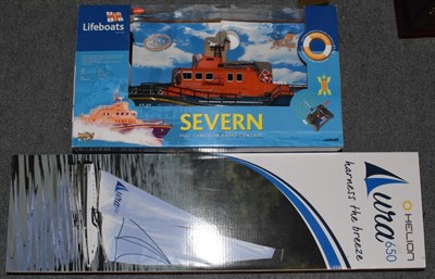 Lot 1137 - Helion Aura 650 radio controlled yacht and a lifeboat (both boxed)