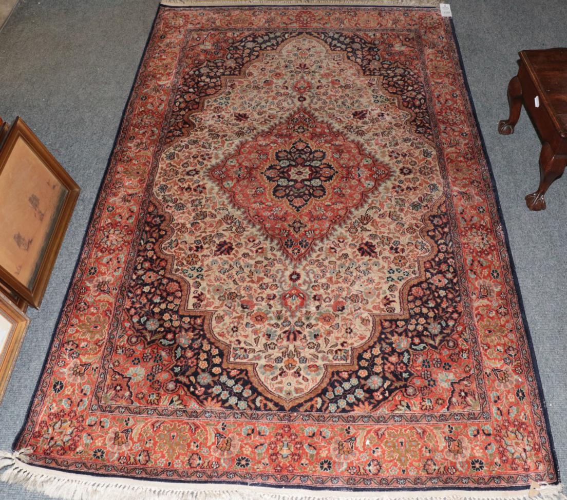 Lot 1179 A Kashmir silk on silk rug, the ivory field
