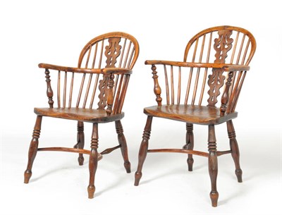 Lot 1140 - A Matched Pair of Mid 19th Century Yew, Ash and Elm Windsor Armchairs, the low double bow back...