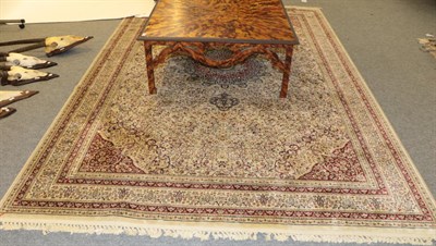 Lot 1193 - A machine made carpet of Oriental design, 333cm by 239cm