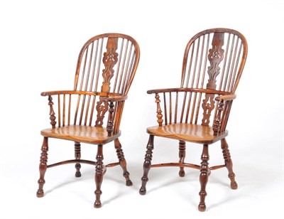 Lot 1141 - A Pair of Early 19th Century Nottingham Yew and Ash Windsor Chairs, the high double bow back...