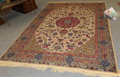Lot 1197 - A machine made carpet of Oriental design, 290cm by 198cm