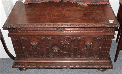 Lot 1209 - A mid 19th century oak chest decorated with kings and lions, 100cm wide