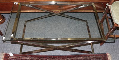 Lot 1215 - A glass top and chrome coffee table, 122cm wide