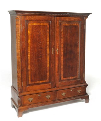 Lot 1146 - An Oak and Mahogany Crossbanded Double Door Cupboard, late 18th century with alterations, the...