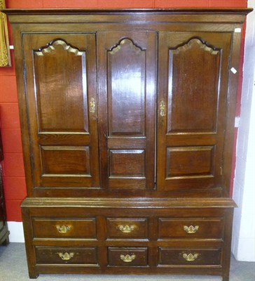 Lot 1157 - An 18th Century Joined Oak Press Cupboard, the bold cornice above two fielded panel cupboard...