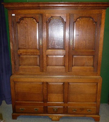 Lot 1158 - A Mid 18th Century Joined Oak Press Cupboard, the upper section with two fielded panels flanked...