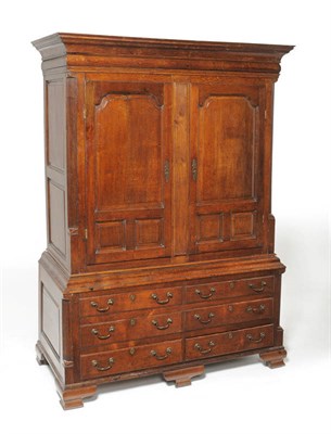 Lot 1159 - A George III Oak Clothes Press, 3rd quarter 18th century, with two fielded panel doors...