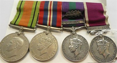 Lot 22 - A Second World War Long Service Group of Four Medals, comprising Defence Medal, War Medal,...