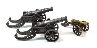 Lot 57 - A Pair of Cast Iron Models of Cannons, each with 24cm tapering barrel with four graduated...