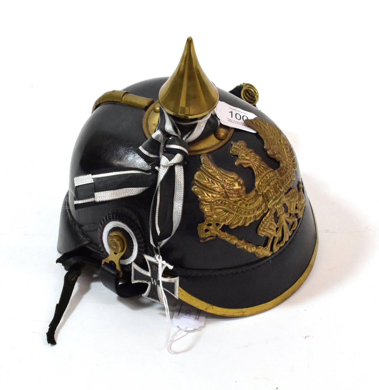 Lot 100 - A Copy of a Prussian Leather Pickelhaube, with brass spike, rib and binding to the front brim, with