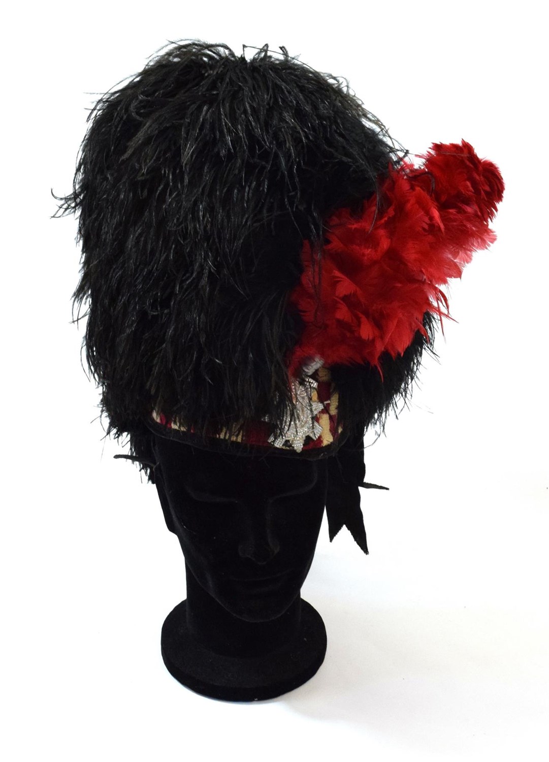 Lot 102 - A Highland Feather Bonnet to the Black Watch, the wirework frame with black ostrich feathers...