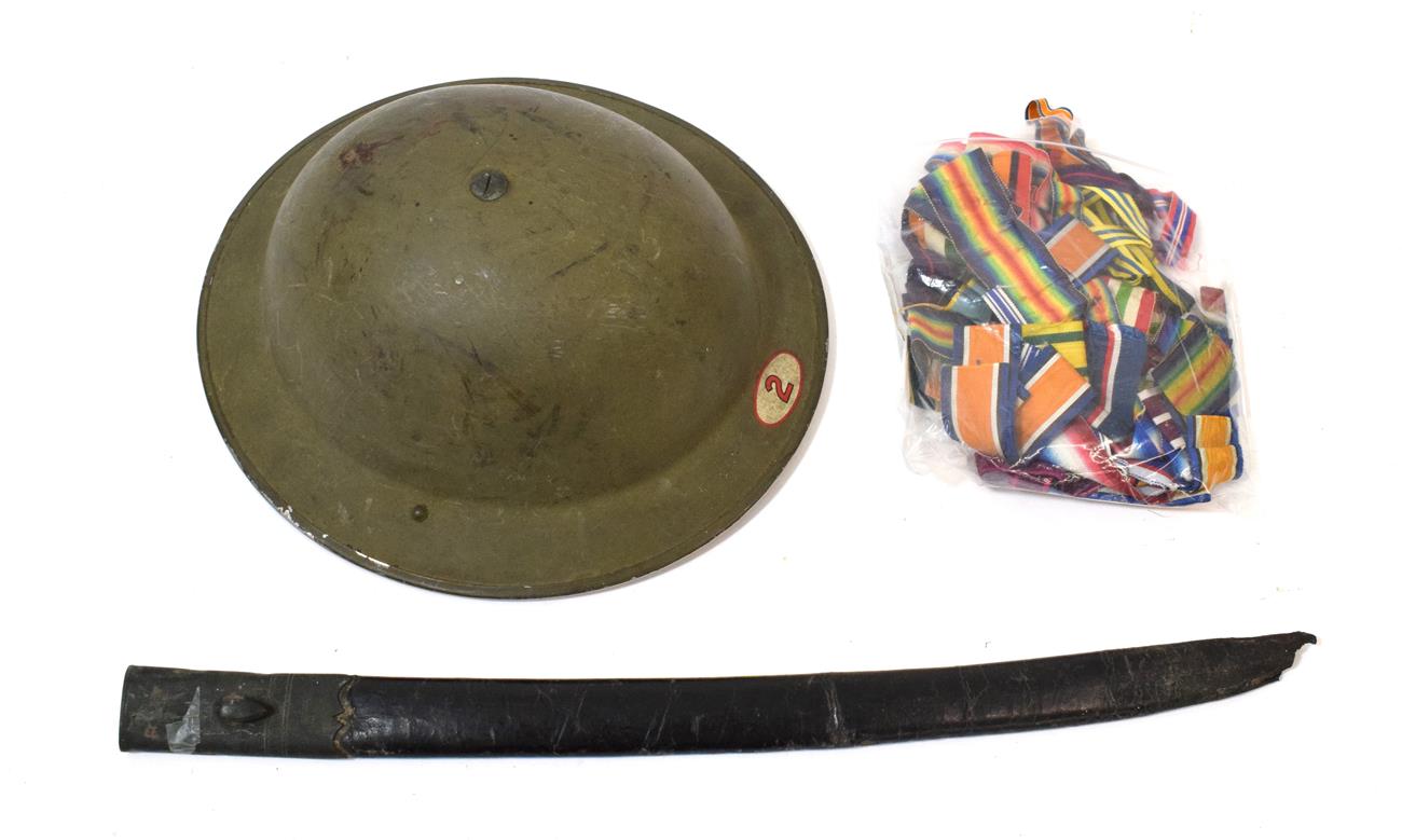 Lot 105 - A Second World War Civil Defence Brodie Helmet, finished in olive green paint with a transfer 2...