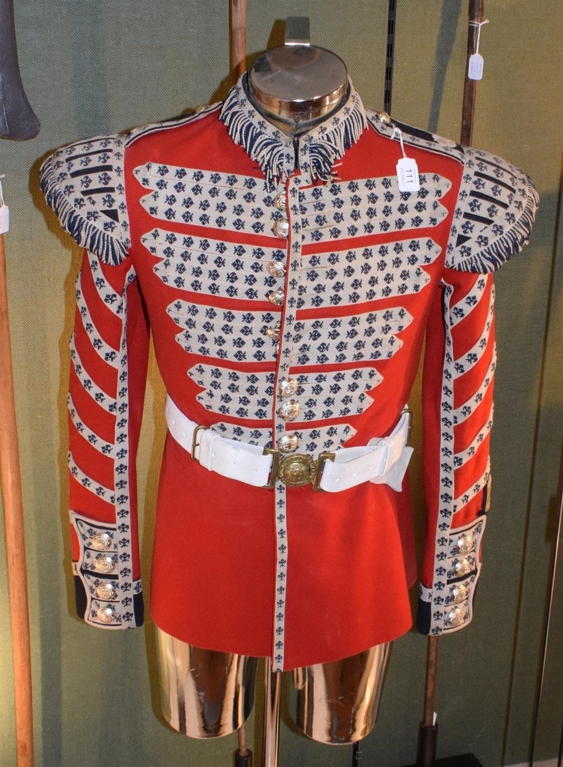 Lot 111 - A Scarlet Wool Tunic to a Drummer of the Coldstream Guards, with fleur de lys woven braiding,...