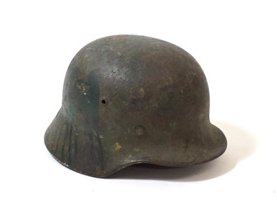 Lot 113 - A German Third Reich M35 Single Decal Army Combat Helmet, bearing traces of later green paint,...