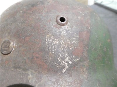 Lot 113 - A German Third Reich M35 Single Decal Army Combat Helmet, bearing traces of later green paint,...