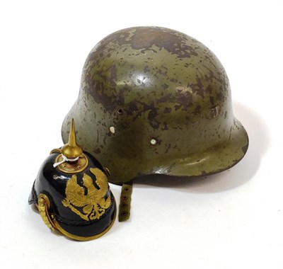 Lot 122 - A Miniature Prussian Pickelhaube, in black patent leather with brass spike, rib, brim edge and...
