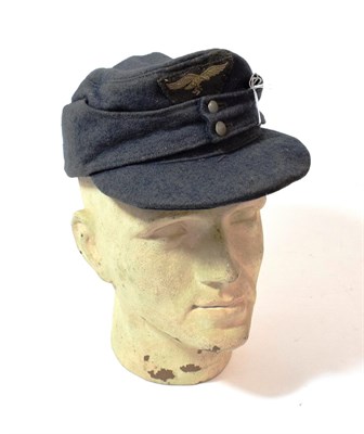 Lot 129 - A German Third Reich Luftwaffe EM/NCO's M34 Field Cap, in blue grey wool, the front stitched with a