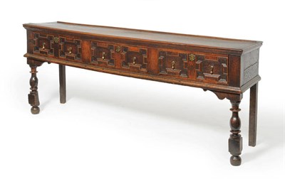 Lot 1172 - A Charles II Oak Dresser, late 17th century, the rectangular top above three geometric moulded...