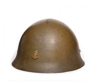 Lot 150 - A Second World War Japanese Type 90 Naval Landing Forces Helmet, with drab olive paint, set...