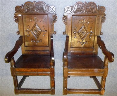 Lot 1174 - A Matched Pair of 17th Century Joined Oak Yorkshire Armchairs, one later carved with initials...