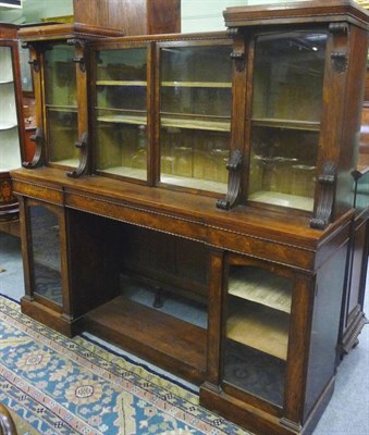 Lot 1177 - A George IV Rosewood Secretaire Bookcase, of recessed breakfront form, the superstructure with...