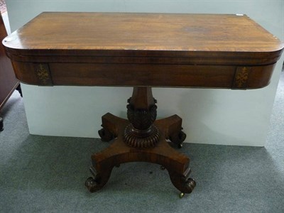 Lot 1178 - A Rosewood, Crossbanded and Brass Strung Foldover Tea Table, circa 1830, with acanthus carved...