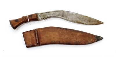 Lot 225 - A Second World War Military Issue Kukri, the curved steel blade marked SA/24, the ricasso...