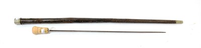 Lot 229 - An 18th Century Swordstick, the 58cm tapering diamond section steel blade engraved with scrolls...