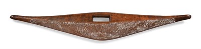 Lot 245 - A 20th Century Australian Aboriginal Parrying Shield, of dark honey coloured wood, of flattened...