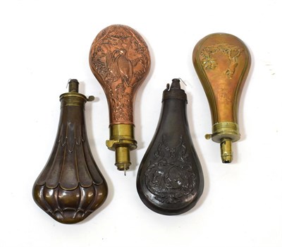 Lot 279 - Four 19th Century Powder Flasks, comprising a pear-shaped brass example, chased to both sides...
