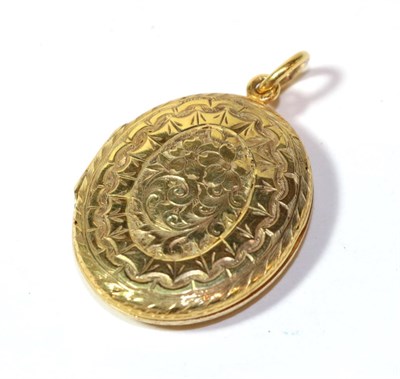 Lot 10 - A foliate engraved locket, unmarked, length 4cm