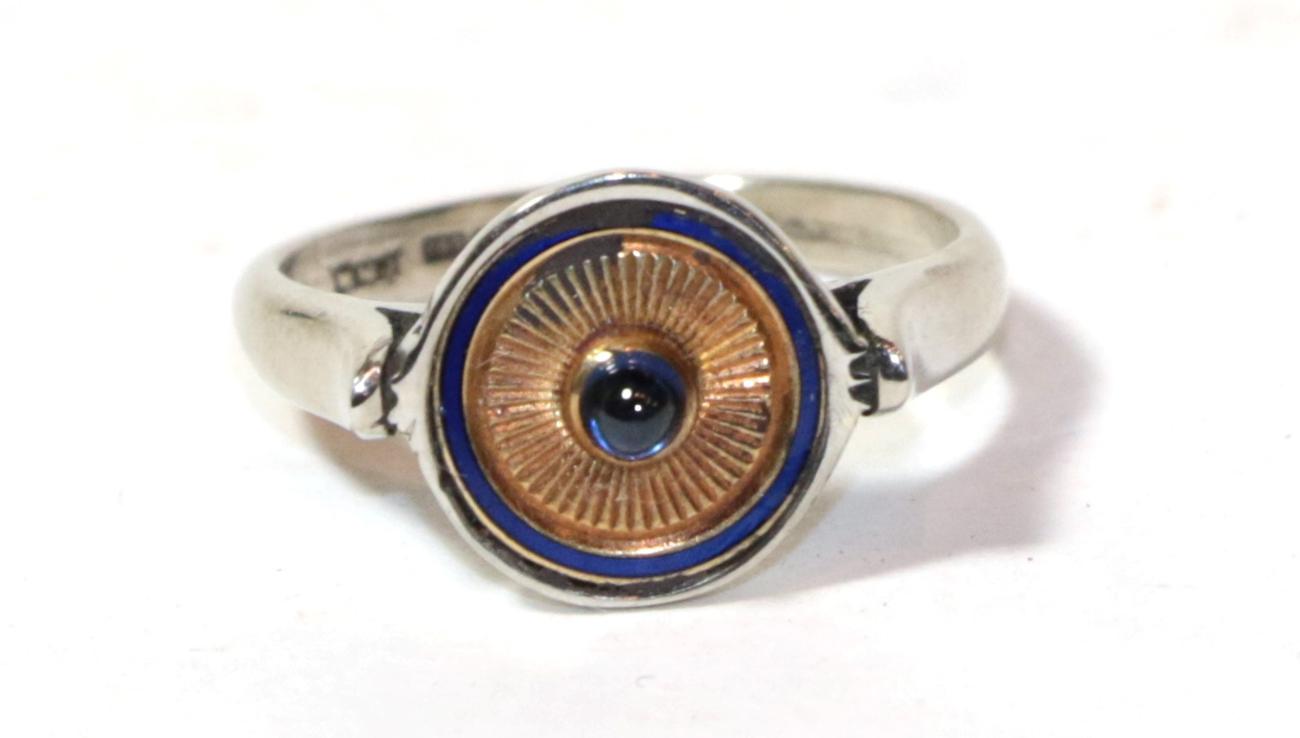 Lot 19 - An 18 carat white gold cabochon sapphire and blue enamel ring, finger size L
