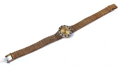 Lot 20 - A 9 carat Bueche Girod wristwatch, diamond and sapphire bezel