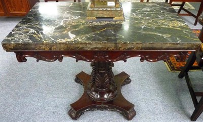 Lot 1196 - A Carved Centre Table, mid 19th century, stamped Currie & Co, Calcutta, the rectangular marble...