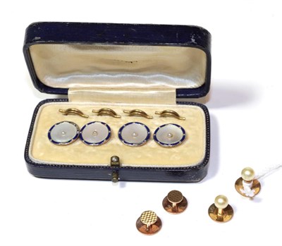 Lot 26 - Four buttons comprised of mother of pearl, blue enamel and seed pearl (a.f.), stamped '9CT',...