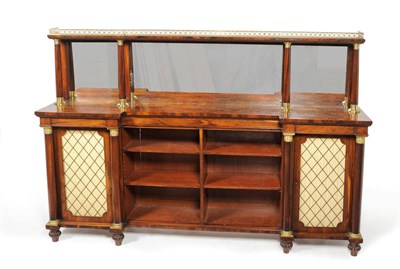 Lot 1197 - A Late Regency Rosewood and Ormolu Mounted Open Breakfront Bookcase, the upper section probably...