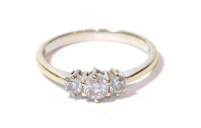 Lot 31 - A three stone diamond ring, stamped '18K' and '750', finger size N