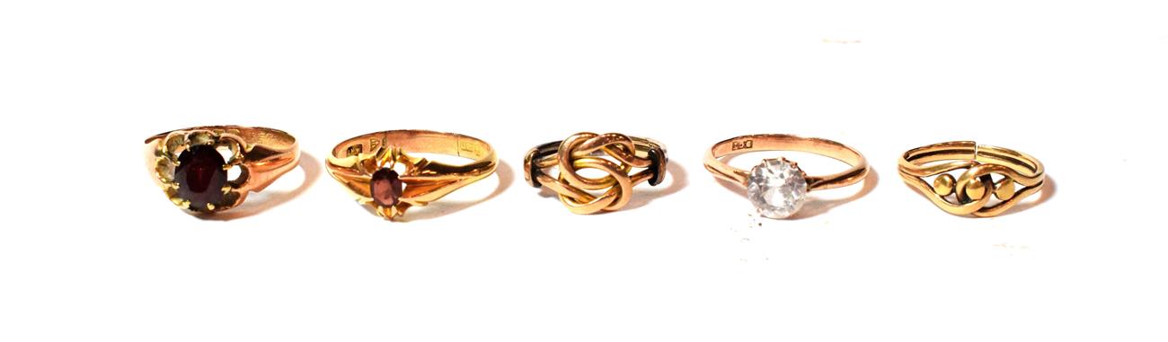 Lot 32 - A 9 carat gold knot ring, finger size M; a knot ring, marks rubbed, band cut; two 9 carat gold...