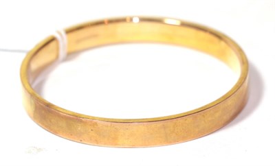 Lot 34 - A 9 carat gold bangle, internal diameter 7.1cm