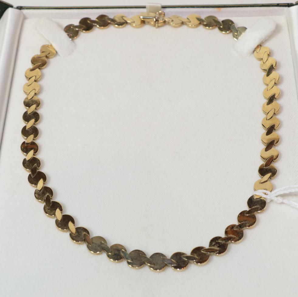 Lot 47 - A fancy link necklace, clasp stamped '375', length 41.5cm