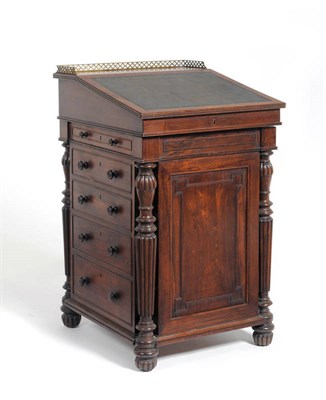 Lot 1199 - A George IV Rosewood Davenport, 2nd quarter 19th century, with a three-quarter pierced brass...